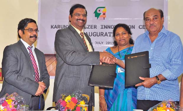 The chancellor of Karunya University Dr Paul Dhinakaran exchanges MoU with Doraiswamy, managing director of Salzer electronics ltd., in Coimbatore, on Tuesday (Photo: DC) The chancellor of Karunya University Dr Paul Dhinakaran exchanges MoU with Doraiswamy, managing director of Salzer electronics ltd., in Coimbatore, on Tuesday (Photo: DC)